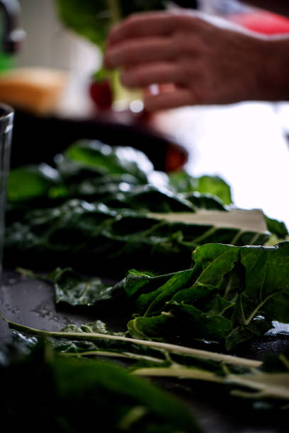 istock Mangold leaves (chard) preparing for cooking, close-up 1058450132
