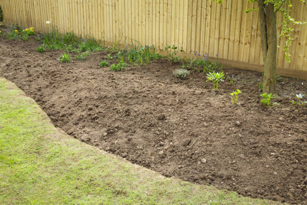 istock Preparing a garden flowerbed for planting 1058452350