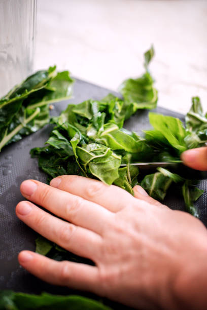 istock Mangold leaves (chard) preparing for cooking, close-up 1058452484