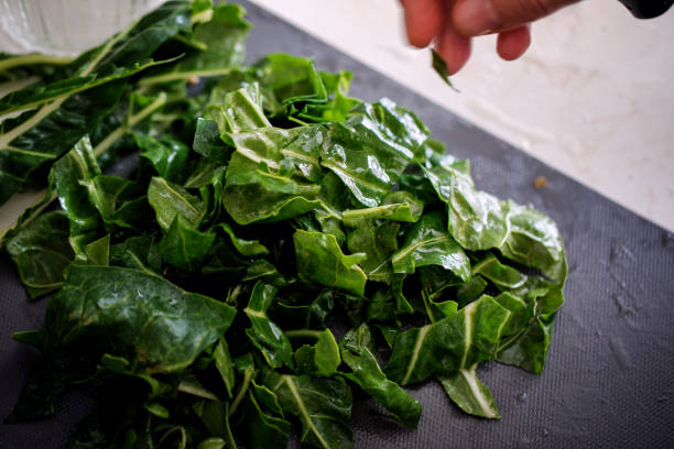 istock Mangold leaves (chard) preparing for cooking, close-up 1058452516