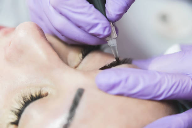istock Female patient on macro eyebrows treatment 1058455946