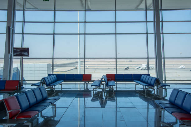 istock Airport terminal interior with rows of empty seats 1058456500