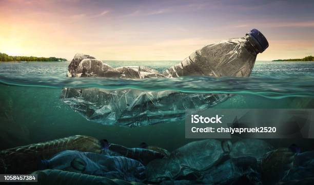 Plastic Water Bottles Pollution In Ocean Stock Photo - Download Image Now