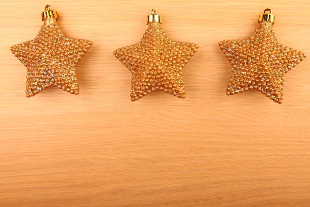 istock New year gold stars wooden table 1058457462