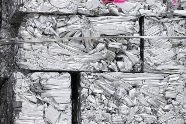 istock pressed aluminum scrap for recycle, silver metal recycling. 1058460732