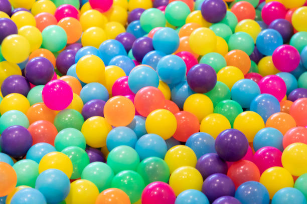 istock colourful plastic balls background for kid activity in indoor playground. 1058460756