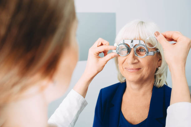 istock senior woman having her eyesight examening using a trial frame 1058465782