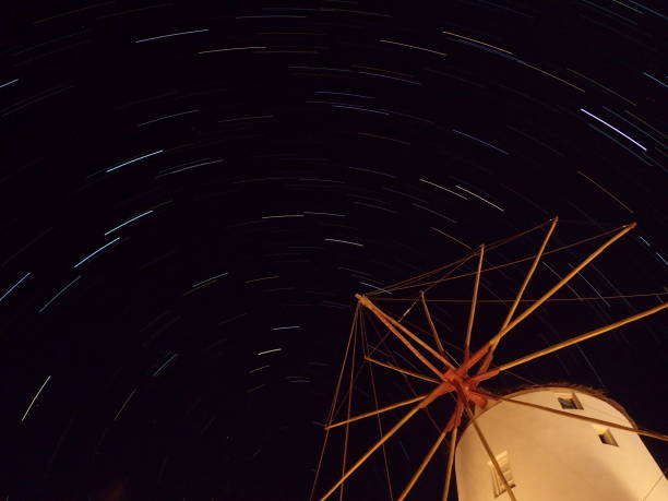 istock long exposure stars behind a greek windmill - 2 1058465870