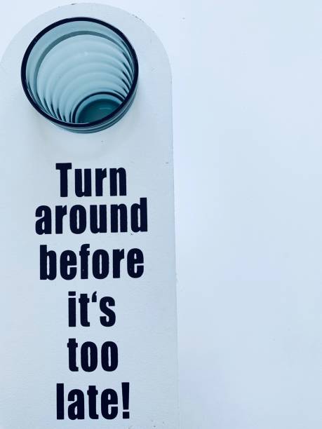 istock Door sign and empty glass, message: Turn around before it's too late 1058468290