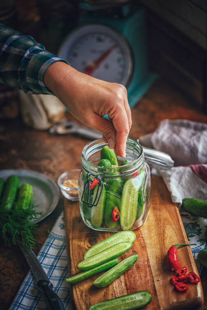 istock Preserving Organic Cucumbers in Jars 1058468464