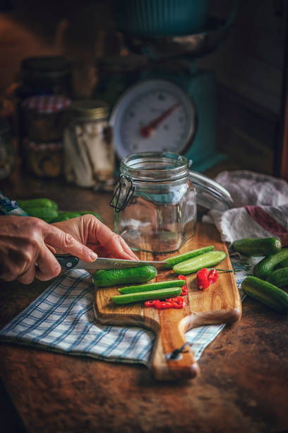 istock Preserving Organic Cucumbers in Jars 1058468504