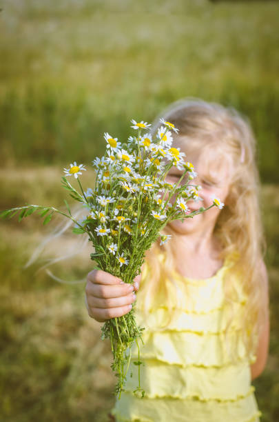 istock child with flowers 1058472554
