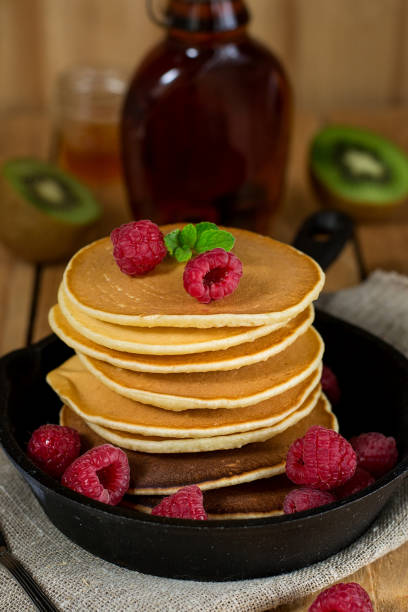istock Pancakes hotcakes with berries and fruit served with maple syrup 1058473606