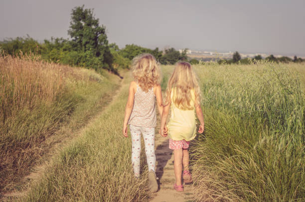 istock two lovely girl in nature 1058473842