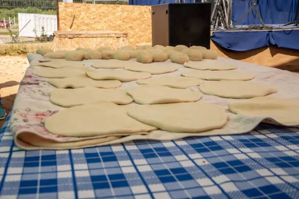 Photo of Some raw sopaipillas on a table