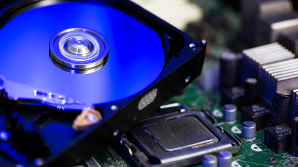 istock Disassembled hard drive from the computer, hdd with mirror effect Opened hard drive from the computer hdd with mirror effects Part of computer pc. 1058480148