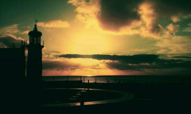 istock Sunset by the sea 1058480316
