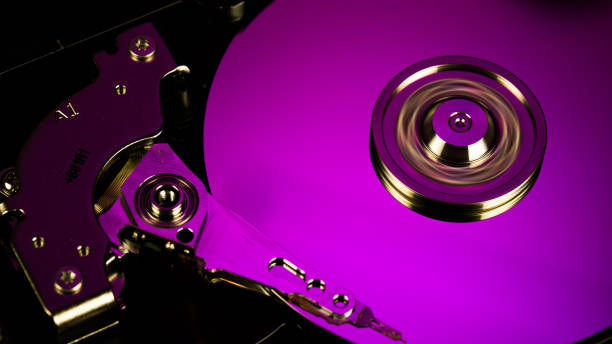 istock Disassembled hard drive from the computer, hdd with mirror effect Opened hard drive from the computer hdd with mirror effects Part of computer pc. 1058480656