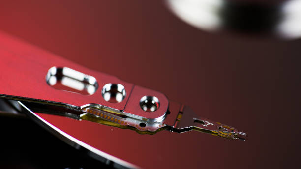 istock Disassembled hard drive from the computer, hdd with mirror effect Opened hard drive from the computer hdd with mirror effects Part of computer pc. 1058481042