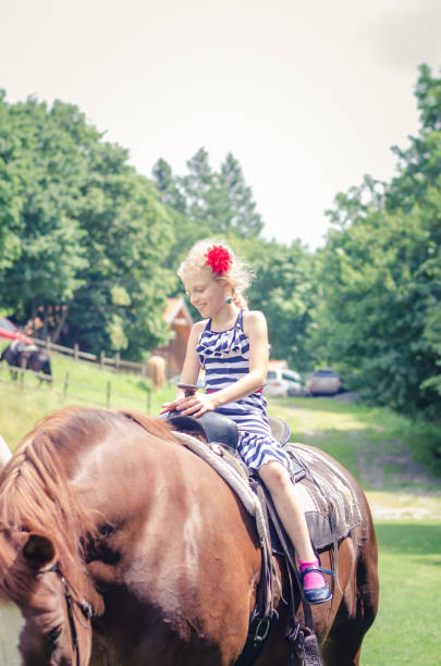 istock girl and horse 1058482774