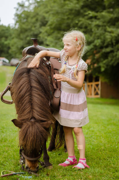 istock child and horse 1058482982