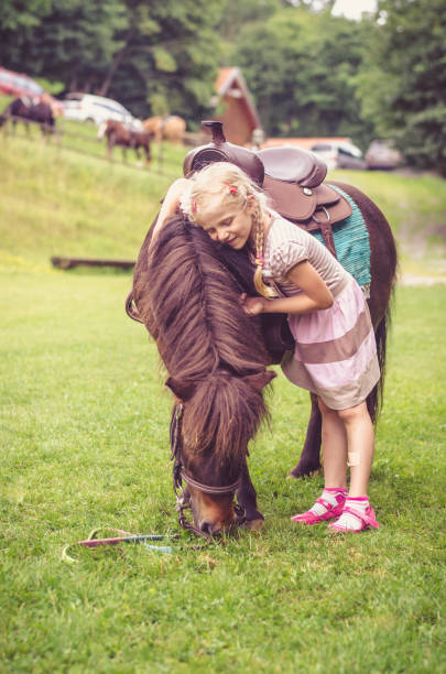 istock child and horse 1058483446