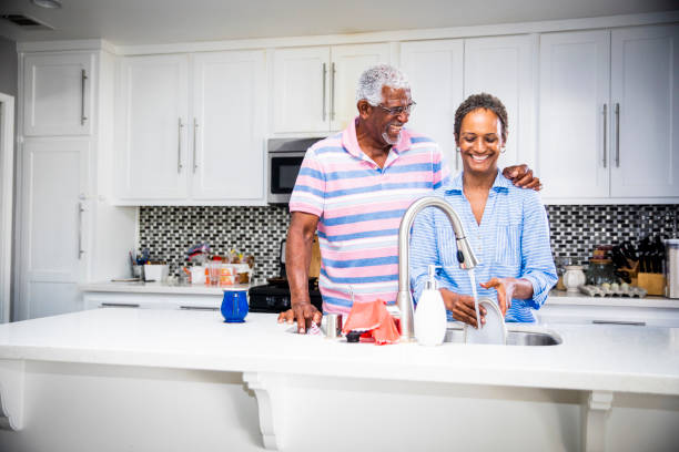istock Senior Black Couple Doing the Dishes 1058486688