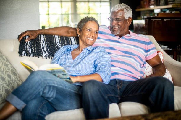 istock Senior Black Man and his Wife Reading a Book 1058486896