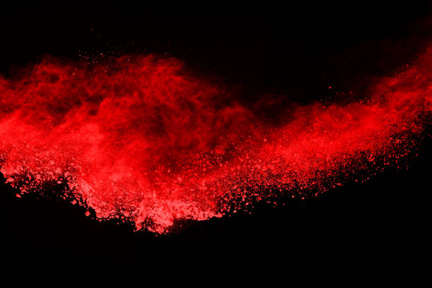 istock abstract red powder explosion on black background.abstract red powder splatted on black background. Freeze motion of red powder exploding. 1058487218