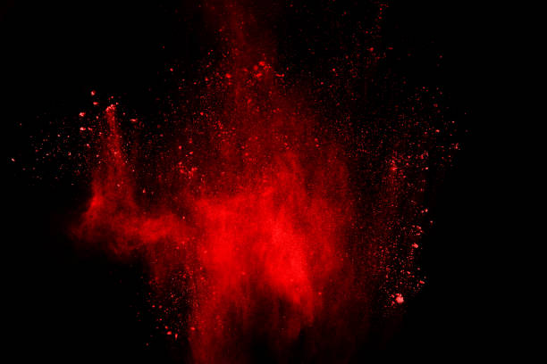 istock abstract red powder explosion on black background.abstract red powder splatted on black background. Freeze motion of red powder exploding. 1058487314