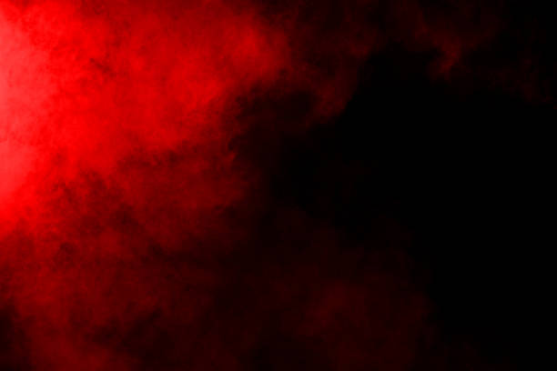 istock abstract red powder explosion on black background.abstract red powder splatted on black background. Freeze motion of red powder exploding. 1058487330