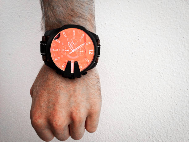 istock big watch on a white man's hand 1058494088
