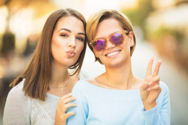 istock Two beautiful young women posing for the camera 1058500700
