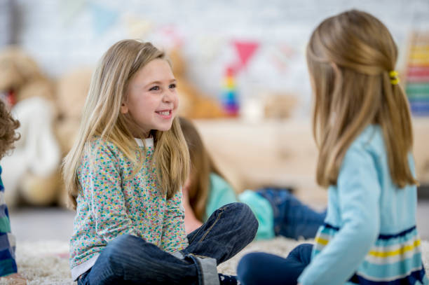istock Girls Talking Together 1058504802