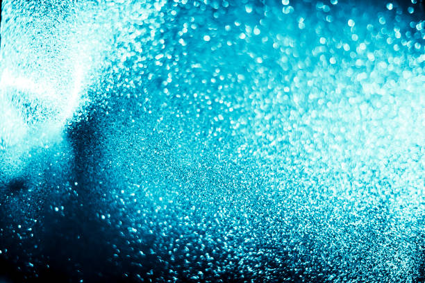 istock Abstract bokeh glitter background. Defocused background. Blurred bright light on black 1058506064