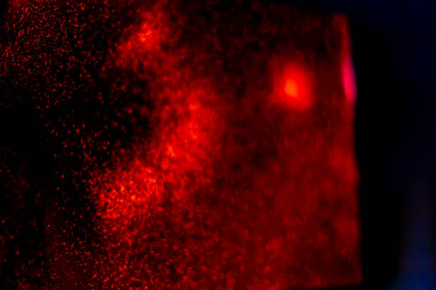 istock Abstract bokeh glitter background. Defocused background. Blurred bright light on black 1058511396