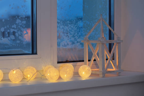 istock winter decor with candles and garland 1058512786