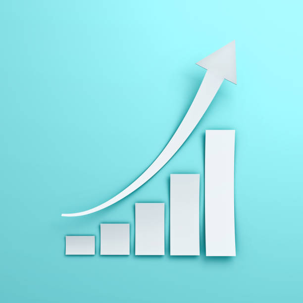 istock White business graph chart with rising arrow  paper cut style on blue pastel color wall background with shadow 3D rendering 1058514082