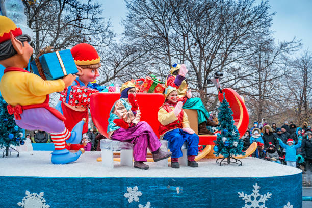 Spectators watch ornate floats and participants move along Bloor Street in Toronto, Ontario, Canada during the Toronto Santa Claus Parade.