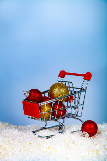 istock Shopping cart with Christmas balls 1058518092