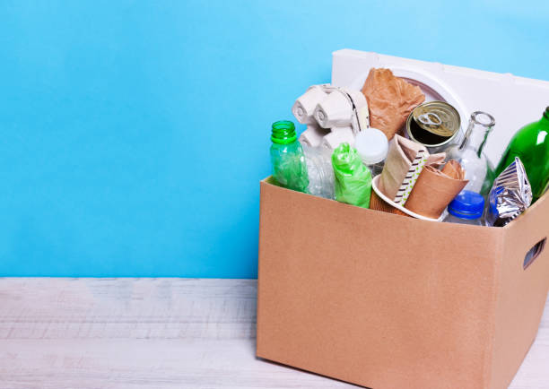 istock cardboard box plastic, glass bottles, cans, paper 1058519612