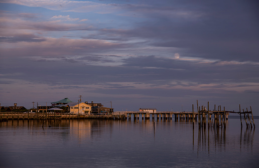 Evening sky with moonrise over Dock Street in Cedar Key, Florida