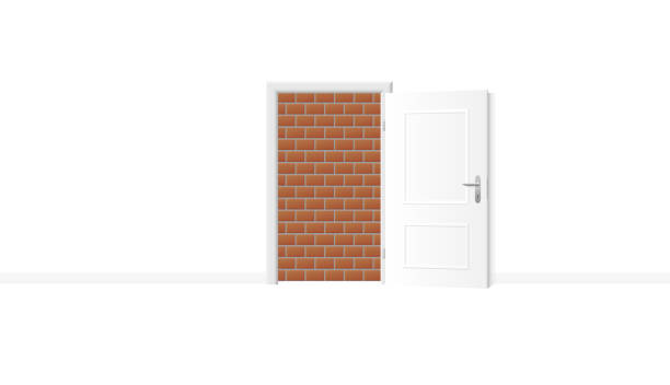 istock Opened white door, but obstructed by an impenetrable brick wall. Symbol for being trapped, jailed and banished, and for blockade, barricade, barrier, captivity or obstruction. Vector illustration. 1058524190