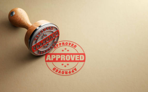 istock Wooden Approved Stamp On Recycled Paper 1058525308