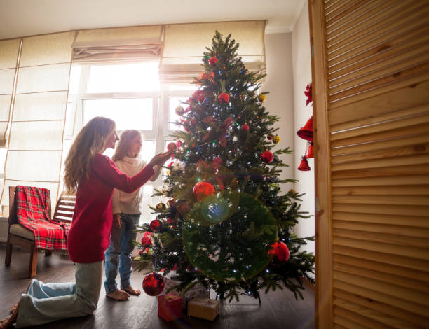 istock Family decorate Christmas tree 1058525550