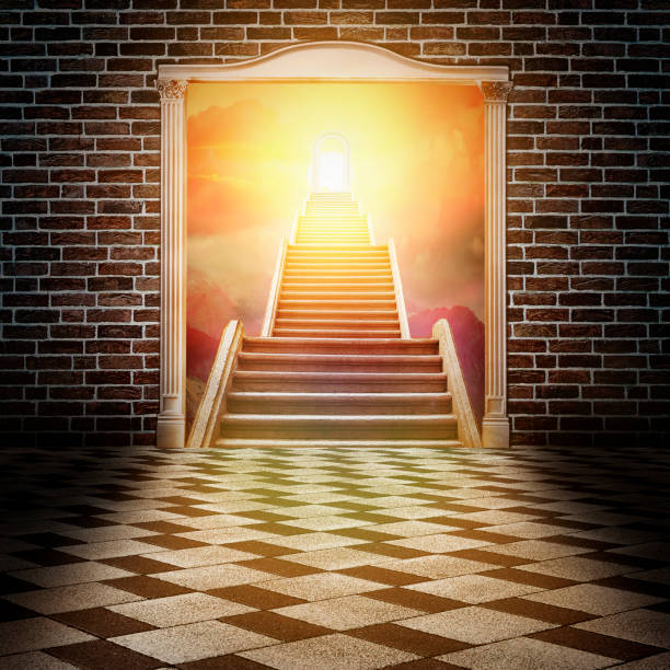 istock ladder rising  in white double-leafed door on  old brick wall 1058526650