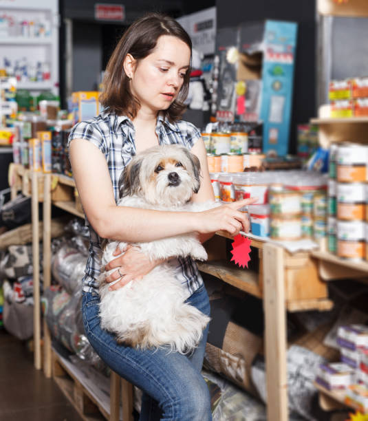 istock female with dog selecting vet  preserves 1058527072