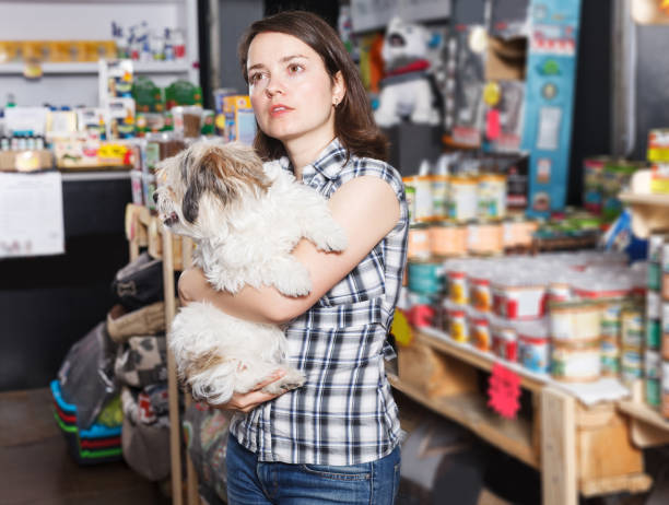 istock female with dog selecting vet  preserves 1058527080
