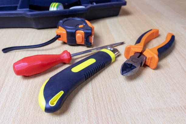istock Tools laid out on a room floor. Construction and repair concept 1058528276