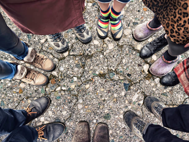 istock feet of people standing in a circle 1058528356